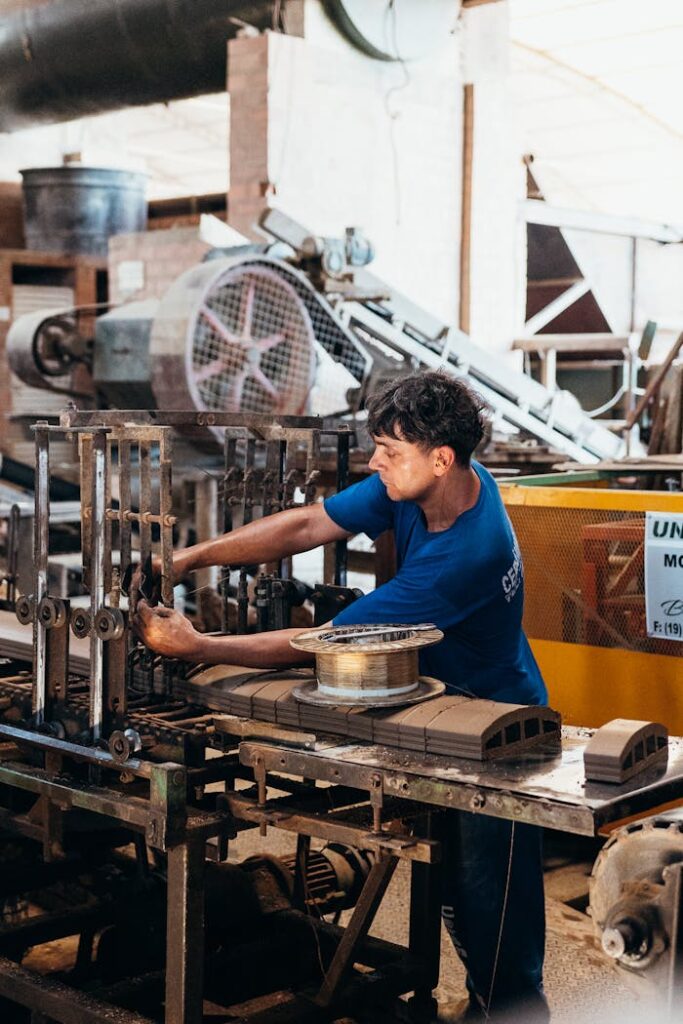 Industrial Worker Operating Factory Machinery